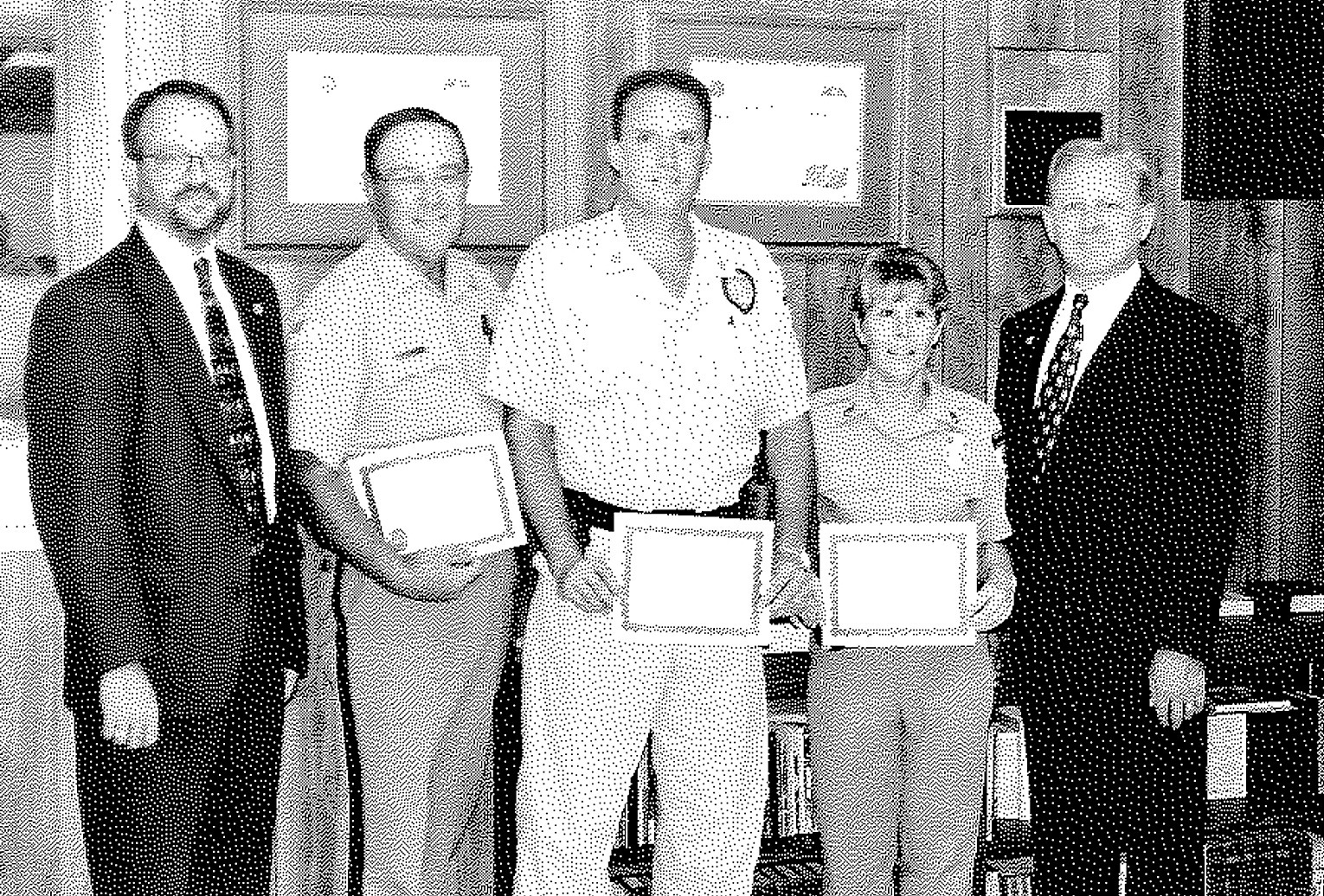IN THE SUMMER OF 1997 the Branch of the Norton Correctional Facility was recognized. Present for the awards ceremony were (from left) warden Jay Shelton; Tom Norris who was promoted to COII; Rick Bice who was promoted to COII; Jill Emery who was promoted to CSI; and Secretary of Corrections Charles Simmons.