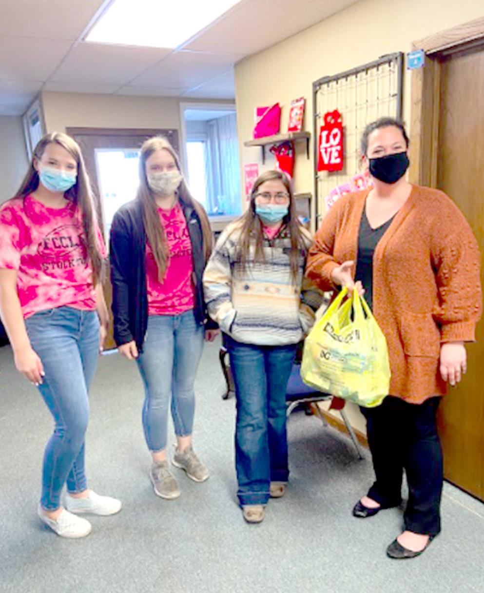 STOCKTON FCCLA STUDENTS Taigen Kerr, Savvy Gray and Tierra Yohon delivered “Blessing Bags” to Brenda Reiners with Under His Wings Family Shelter in Plainville (left picture); to Pattie Jackson (center picture on far left) with the Stockton Food Pantry; and Kelsey Hogan with Options Domestic Violence Services of Hays (right picture). The STAR project was designed to gather food and personal hygiene items into Blessing Bags to help benefit families in our area.