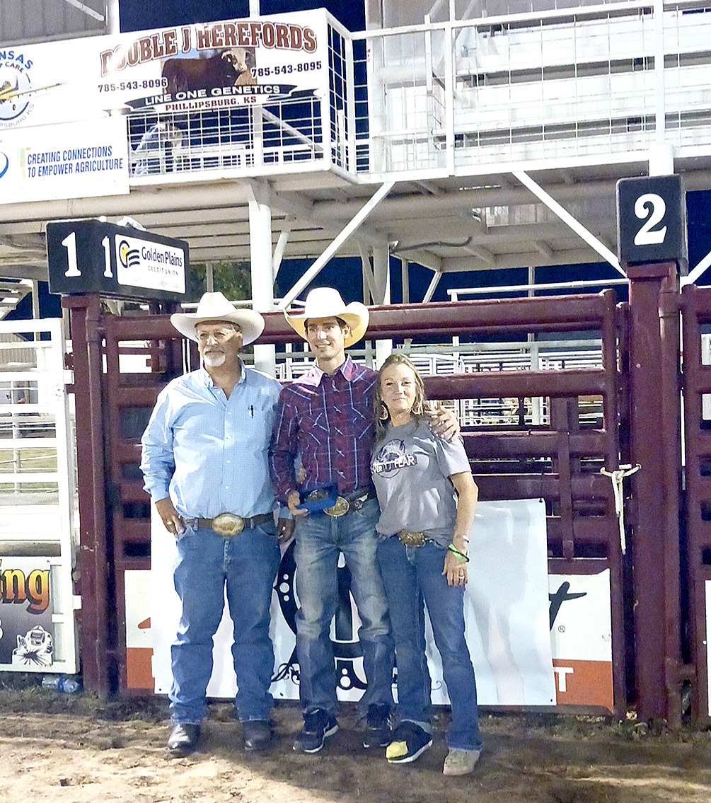 RICHARD’S PARENTS, Harold and Deb Schleicher, took time out to pose with the Richard Schleicher Memorial Bull Riding champion, Chase Hamlin.The event was held at the Phillipsburg Rodeo grounds on Saturday, September 24th. Thirty bull riders showed up to remember and honor one of their own. (Photo Courtesy of Cheyene Carlson)