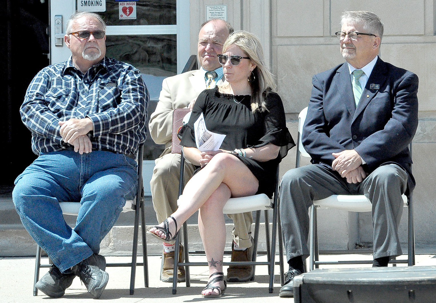 Rooks County Commissioners Tim Berland, Kayla Hilbrink and John Ruder, sitting with Magistrate Judge Doug Bigge (behind)