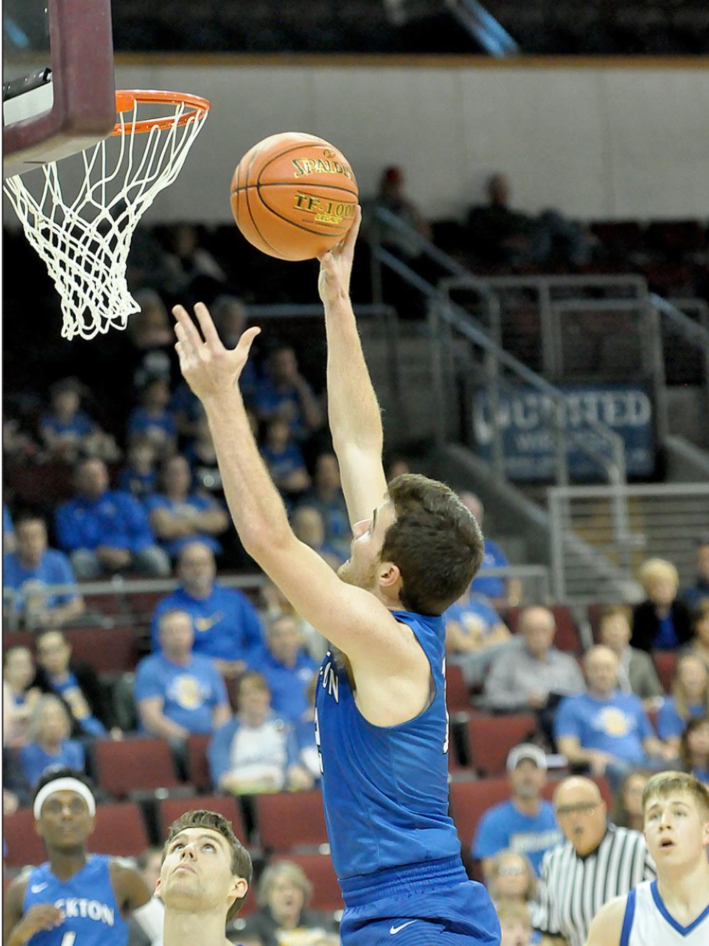 GAGE CONYAC, a senior for the Tigers, goes up for a shot during quarterfinal action of the KSHSAA Class 1A State Basketball Tournament held in Dodge City.