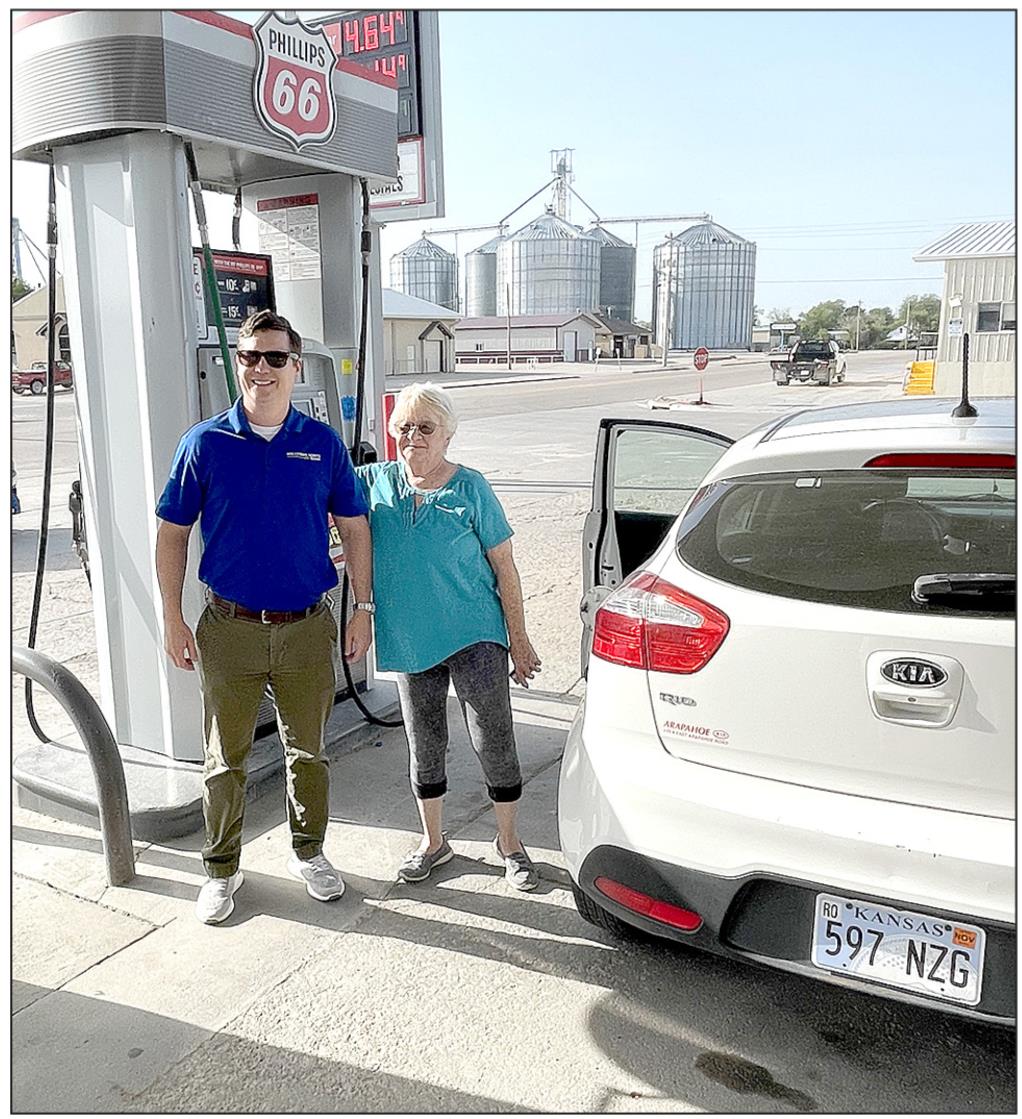 SOLUTIONS NORTH BANK’S BRIAN BERKLEY helps fill up the gas tank of one of the lucky customers at J-Mart when SNB surprised the community last Friday morning by lifting the spirits of many people through this generous gesture.