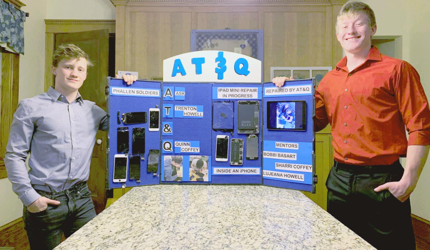 TRENTON HOWELL (LEFT) AND QUINN COFFEY (right) of Stockton High School are pictured with their winning display during the Rooks County Youth Entrepreneurship Challenge held recently. Their concept, call AT&amp;Q (Ask Trenton Howell &amp; Quinn Coffey) did it all with their software/hardware business. They complete repairs of cell phone screens, computers and other technology devices.