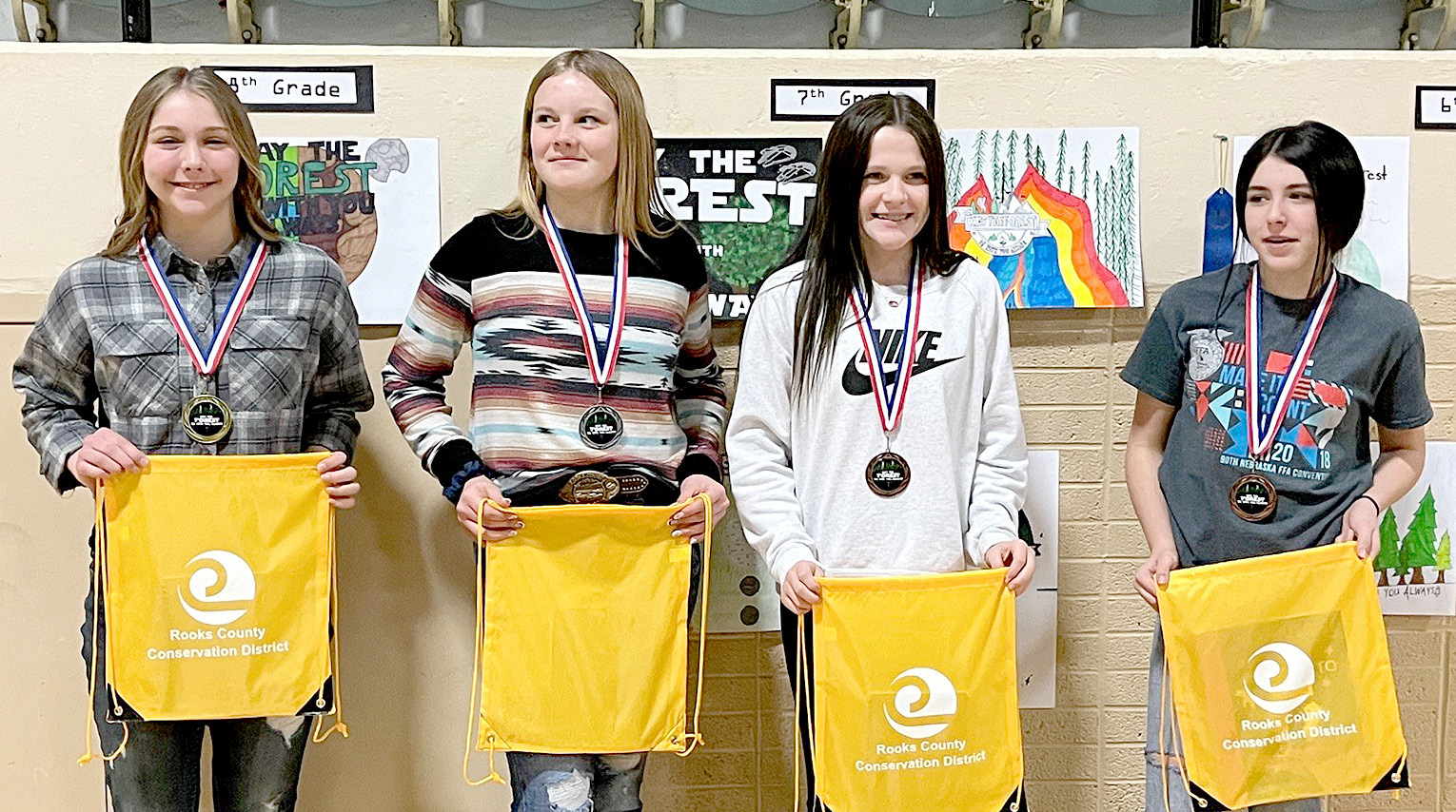 SEVENTH-GRADE POSTER WINNERS (l to r)—1st, Shiloh Kuhn, Palco; 2nd, Kinley Kester, Stockton; 3rd, Faith Armstrong, Stockton; and 4th, Kerra Bradberry, Stockton.