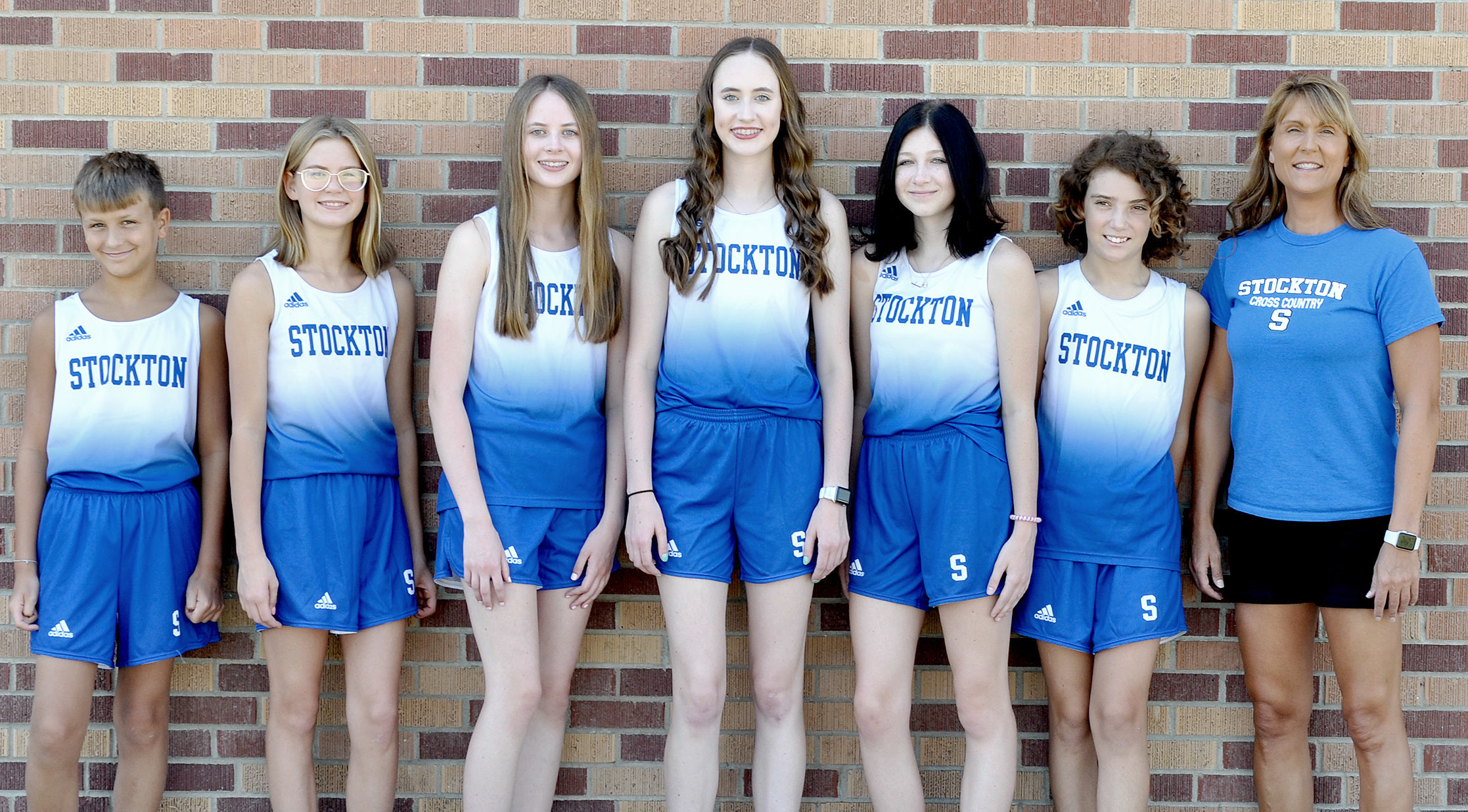 MEMBERS OF THE 2022 STOCKTON HIGH SCHOOL AND JUNIOR HIGH CROSS COUNTRY TEAMS are from left: Kolt Kuhlmann (SJH), Ariel Sager, Cheyenne Hoeting, Cappi Hoeting, Ryleigh Gardner, Christine Jurgens (SJH) and Janet Kuhlmann (head coach).