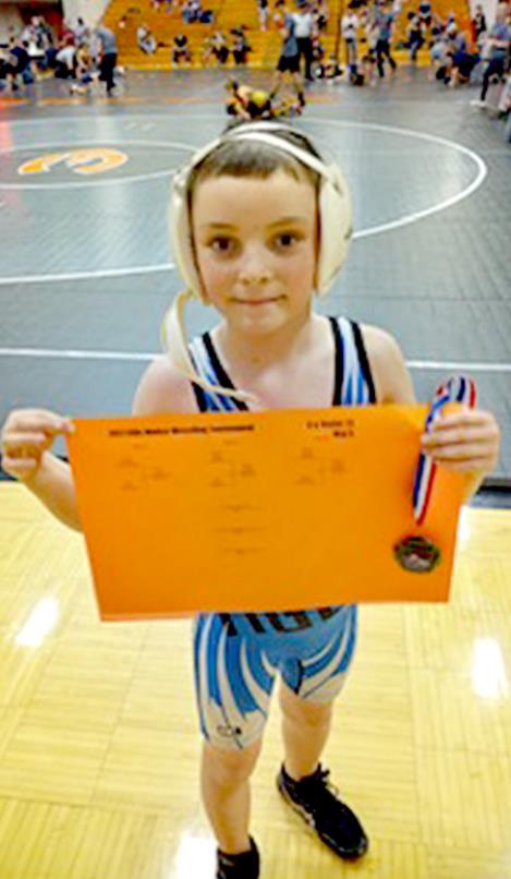 WILLIAM BIGGE, wrestling at 8 &amp; Under 73 lbs. at the Ellis Novice Wrestling Tournament, took first place.