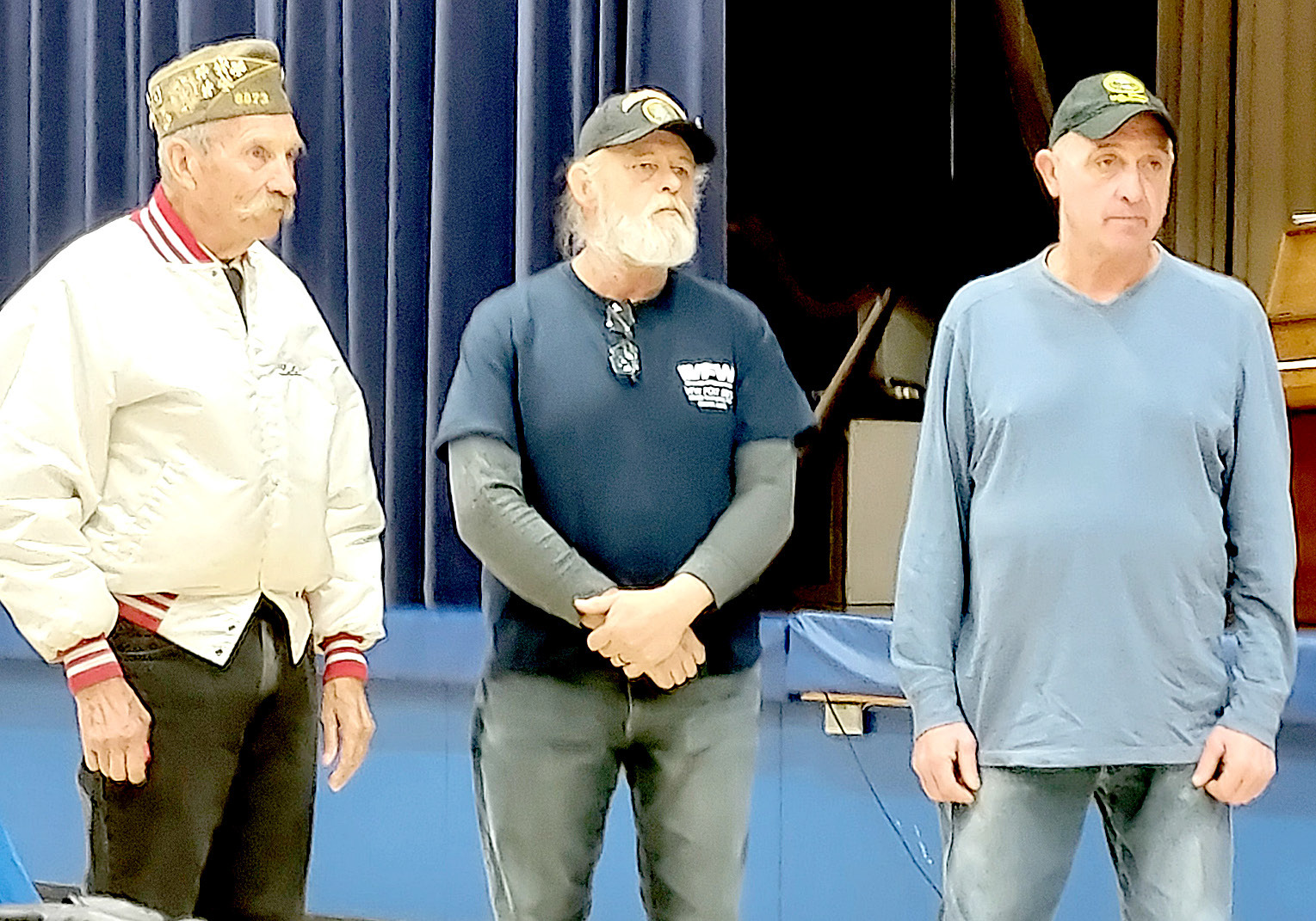 PRESENTED WITH SERVICE AWARDS by Quartermaster John Berkley at the Veterans Day program held at Stockton High School were Mark Trumbo (Korea), Scott Baker (Korea and Beirut) and Ed Thayer (Desert Storm.)