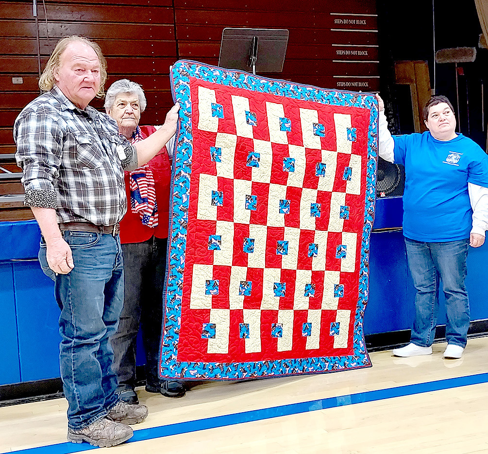 RANDALL PEACOCK (NAVY) received his Quilt of Valor at the Veterans Day program held at Stockton High School on Friday, November 11th. Pictured are Randall Peacock, Judy Russ and Dena Bouchey.