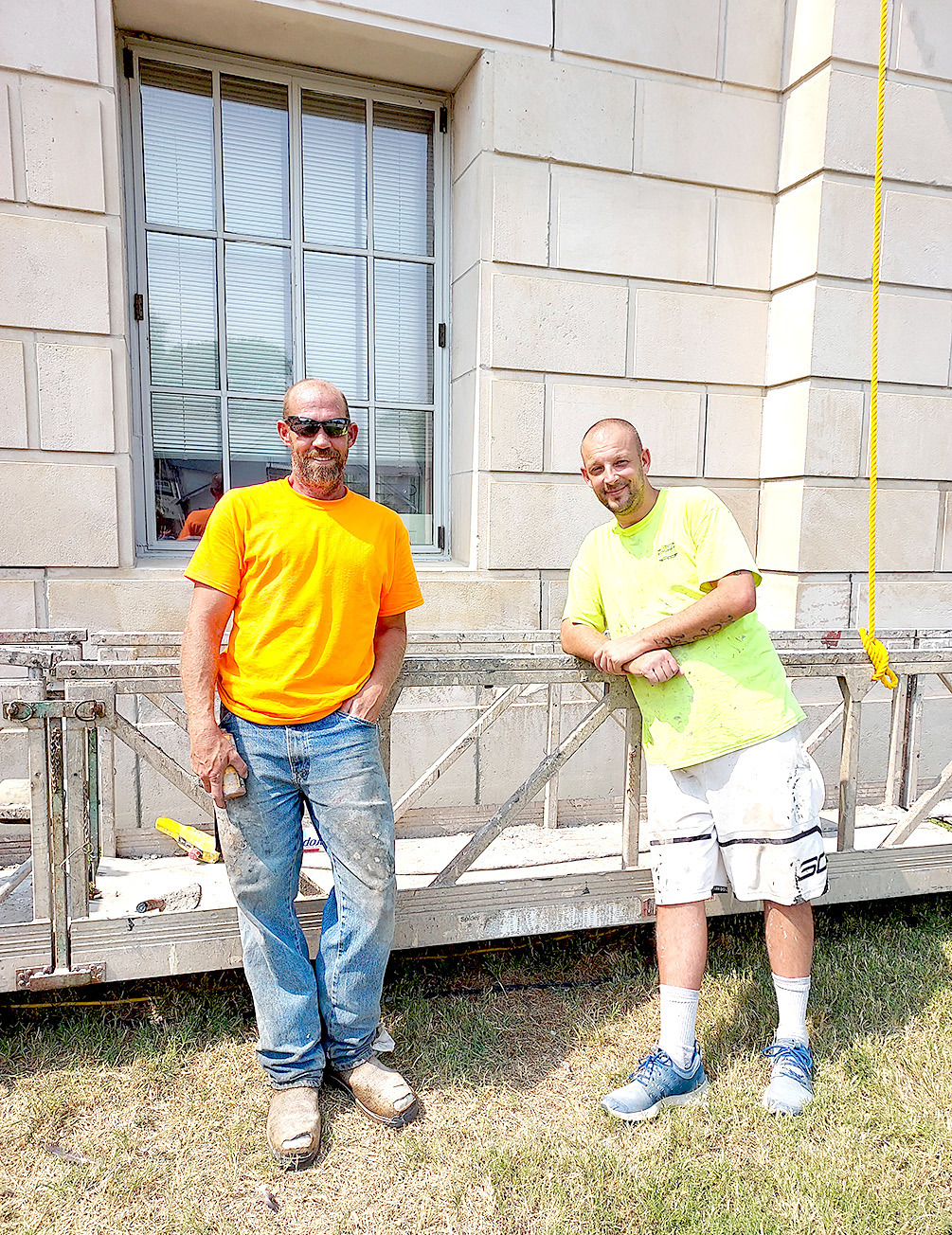 JAKOB STOCKTON, owner of Stockton Restoration, and Jason DePalmo are working on the exterior of the Rooks County Courthouse. They are doing work, which includes power washing, tuck pointing and other miscellaneous repairs to the stone and mortar.