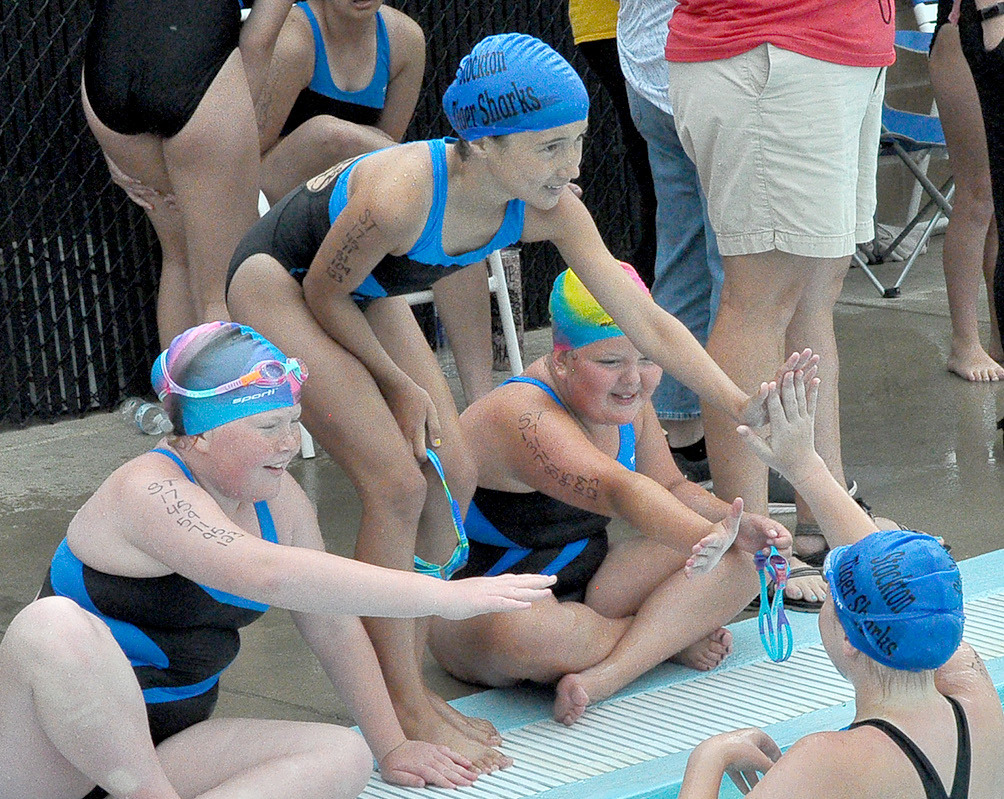 High Fives For Relay Team at Stockton Swim Meet