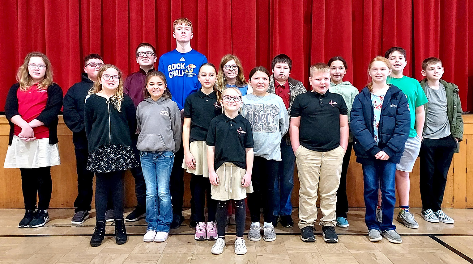 THE TOP SPELLERS representing their schools at the Rooks County Spelling Bee held at Sacred Heart on Friday, February 9th are (front row, from left) Ash Dinkel; (middle row) Kaylee Clayton, Bryah Stithem, Kaylyn Becker, Haddie Carpenter, Max Brewster, Daylan Beesley; (back row) Ava Ryan, Liam Balthazor, Channing Oehm, Cayden Klein, Lyla Oller, Barrett Moore, Hannah Gosselin, Kayne Karlin, and Veidyn Holmes.