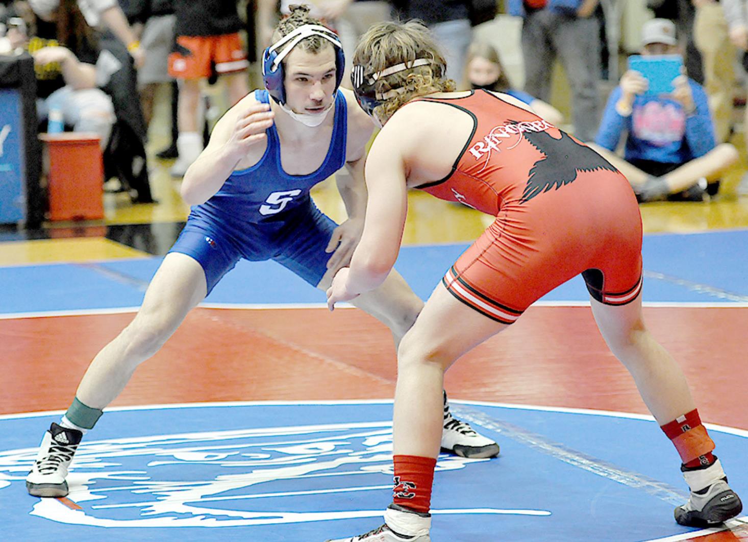 LOOKING TO GET A TAKEDOWN—Leighton Colburn looks for a takedown in the first round of the consolation matches at state wrestling against Hill City’s Aidan Hockman.