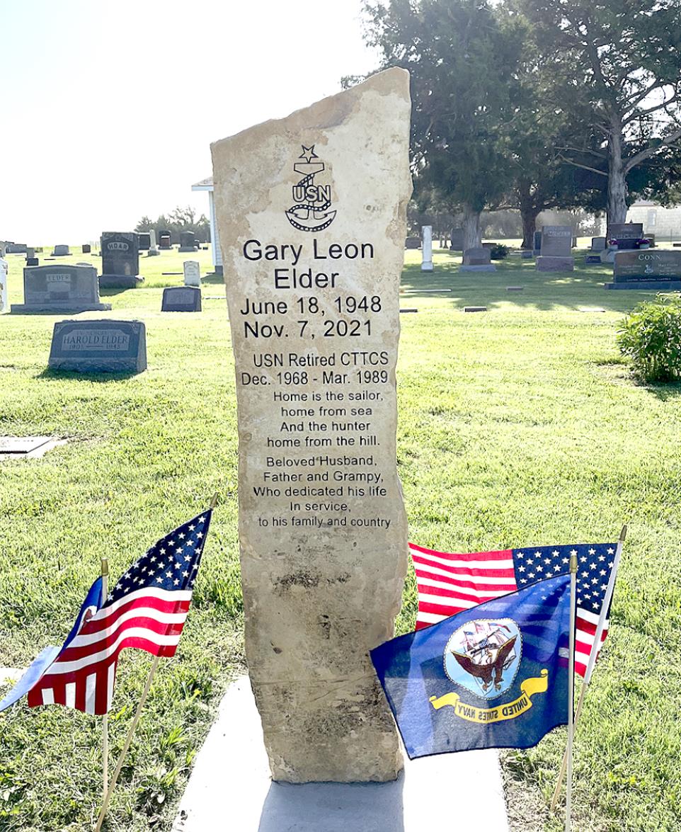 A MEMORIAL STONE made from an old limestone fencepost, was done by Christian Lutz of Schmidt Monument Works in Hays.