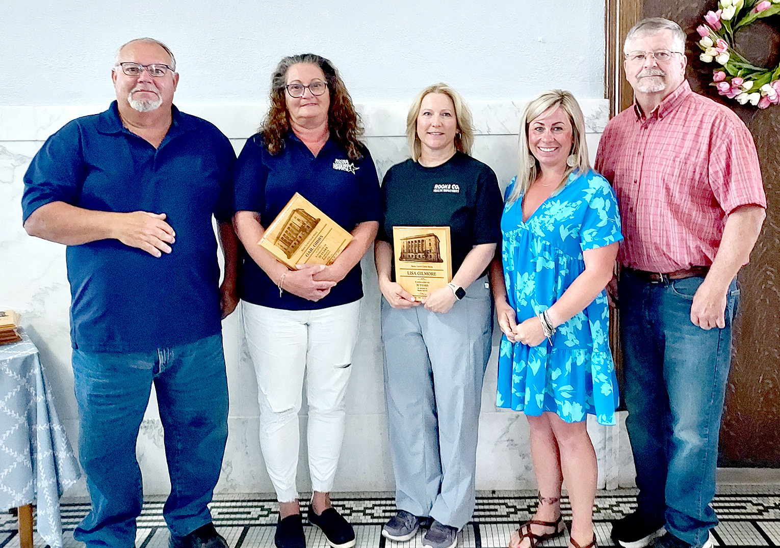 ROOKS COUNTY EMPLOYEES were presented with their 20year plaques at a recent Rooks County Commission meeting. Pictured are (from left): commissioner Tim Berland, Gail Gibbs, Lisa Gilmore, and commissioners Kayla Hilbrink and John Ruder (Not pictured was Jack Kuhlmann.)