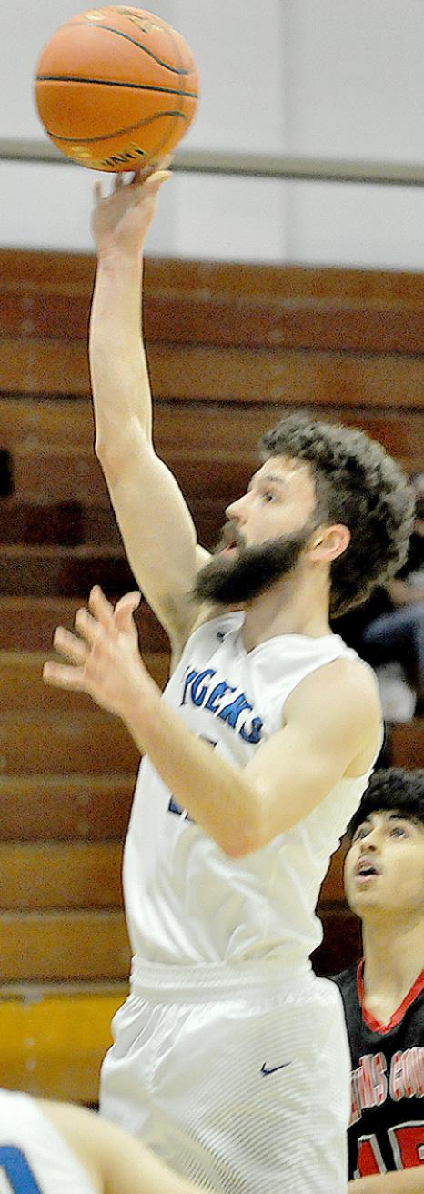 KAMERAN HAMEL releases a shot during the sub-state game against Rawlins County.