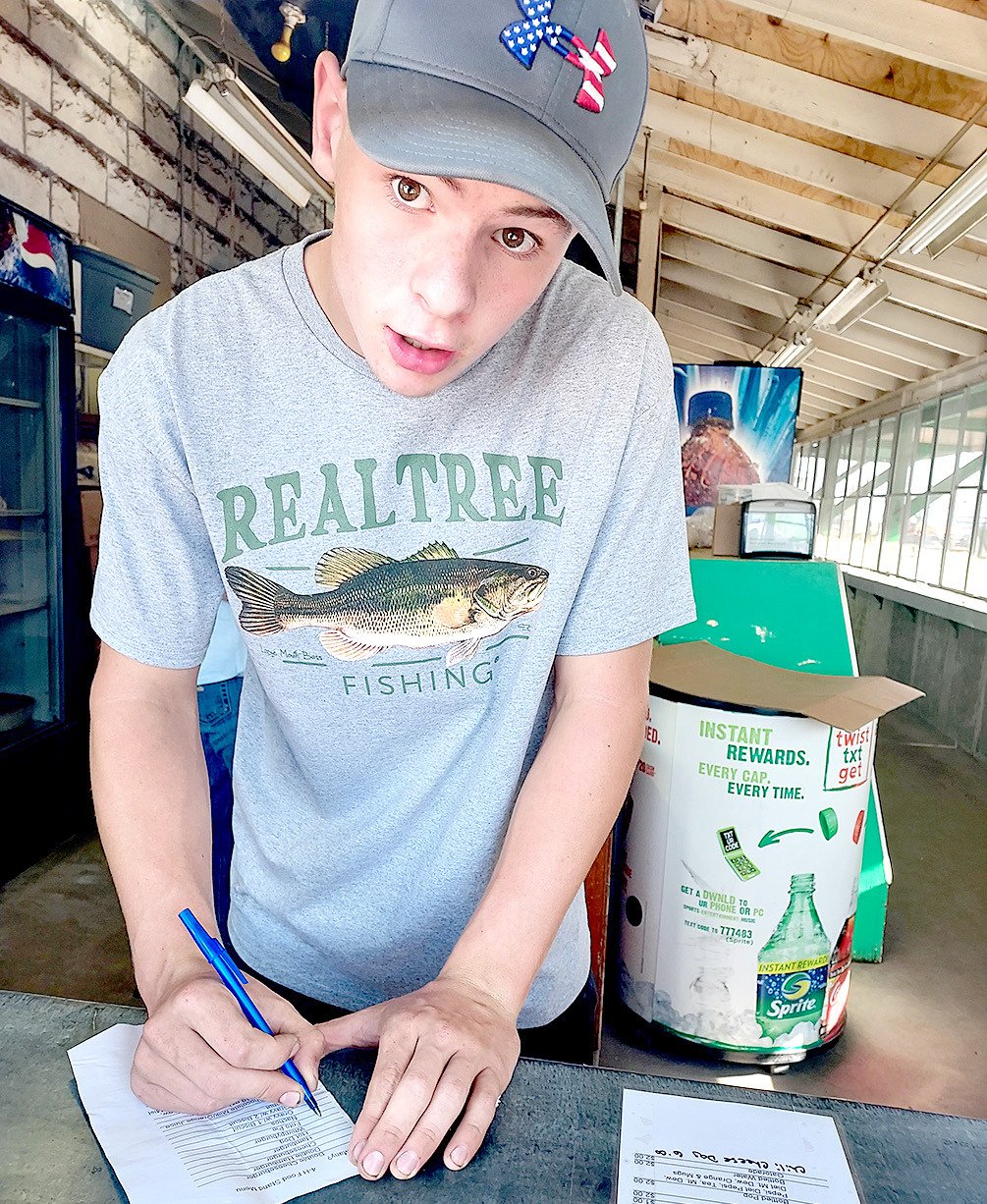 CAN ITAKEYOUR ORDER? Jamie Keller of Palco 4-H helped work the 4-H concession stand on Monday of the Fair.