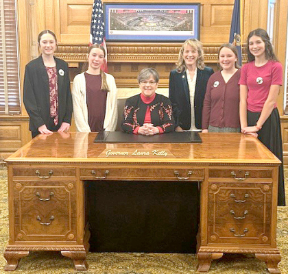 THREE STUDENTS served as pages for Kansas Senator Elaine Bowers at the Capitol in Topeka on March 14. Pictured from left are Savanah Slaubaugh, Hays; Mackenzie Dixon, Plainville; Governor Laura Kelly; Senator Bowers; and Maura Knappert and Maryann Walter, Beloit. They spent the day taking a Capitol tour, shadowing Senator Bowers, attending a Senate session, and running errands for the Kansas Senate.