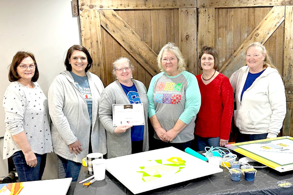 SARA MEITNER, Executive Director of Heartland Community Foundation, presented a certificate to the Rooks County Arts Council quilt ladies recently. The Arts Council was one of four organizations honored with a Community Impact Award. Pictured, left to right, are: Pat Cook, Sara Meitner, Amber Muir, Jayne Prockish, Karen Reed, and Lorie Hessler.
