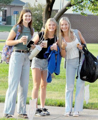 THUMBS UP! Aubrey Kesler, Ashlyn Hahn and Ava Dix are excited to begin their junior year at Stockton High School. The ladies were all smiles as they headed for the halls on the first day of school on August 18.