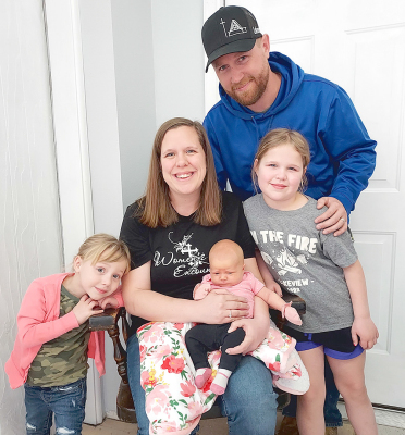 PRETTY LITTLE REBEKAH KAY VANSKIKE claimed the title of this year’s Stockton Sentinel’s NewYear’s Baby. Here she is posing with her family: McKenzie, Holly, Rebekah, Katie, and Luke.