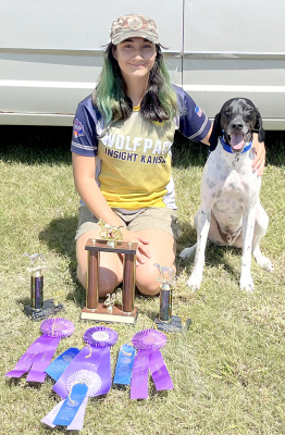 JAYANA CREIGHTON AND ROCKY had a successful outing at the Rooks County Free Fair, winning three High Point trophies in Agility I, II, and III, the Overall Champion trophy, a Champion Purple ribbon, and Blue ribbons. The Agility trophies were sponsored by Kathy Creighton, in memory of Malachi Miller.