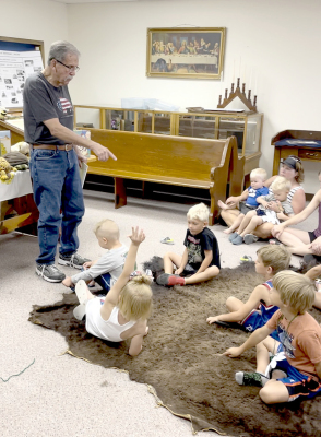 BOB MEISTRELL OF PLAINVILLE shared his knowledge about buffalo with the kids and parents at the story time session held at the Rooks County Historical Museum on Saturday, June 24th.