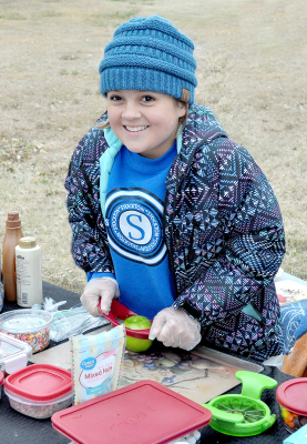 SERENITY CARPENTER helped at the Motion Dance Company booth during this year’s Pumpkin Patch. They sold apple nachos with various fall toppings as a fundraiser for their group.The caramel, nuts, and chocolate chip combo was amazing!