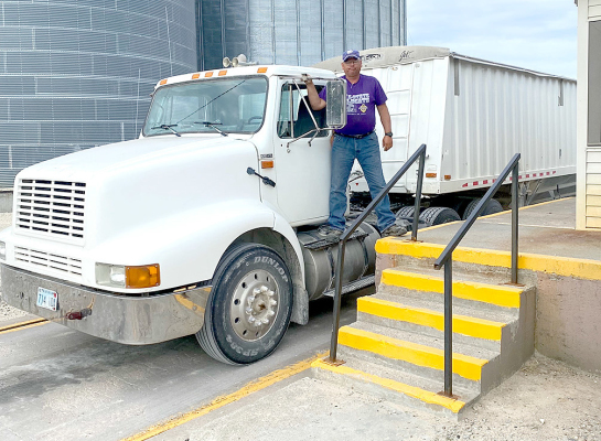 SHAWN MCREYNOLDS, driving for Jerry McReynolds, brought the first load wheat into the Woodston Coop on Friday, June 23rd. The area wheat harvest is officially underway! (Courtesy photo)