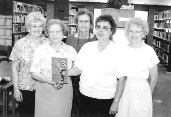 IN AUGUST OF 1991, the Home Club and Stockton EHU presented the Stockton Public Library with the book “The Wars of Peggy Hull,” the life and times of a war correspondent. Presenting the signed copy by authors Wilda M. Smith and Eleanor A. Bogart to the library were (from left) Mrs. Violet Riffe, Mrs. Helen Lindsey, Mrs. Helen Overley, librarian Mrs. Neola Breckenridge, and Mrs. Elsie Lowry.