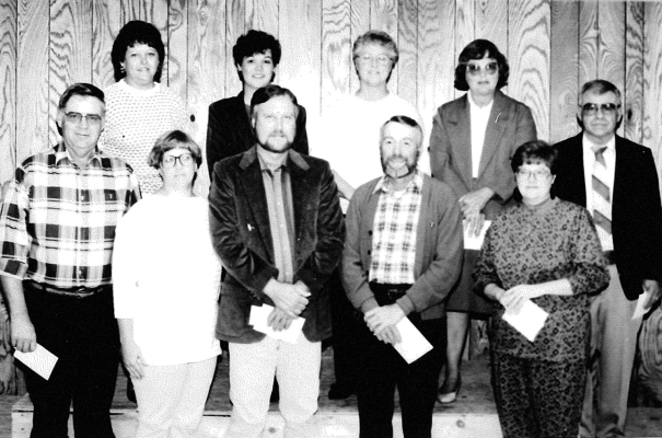 THE 4-H LEADERS who received pins at the 1991 4-H Achievement Banquet for their years of service in the organization were (front row, from left) Larry Odle, Bonita Wagner, Jim Stice, Stan Grecian, Pam Rudman; (back row) Karen Rachel, Kathy Stice, Loretta Ross, Mary Towns, and Therean Towns.