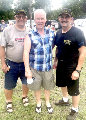 DICK SHERBONDY, along with his Canadian friends from Edmonton, Alberta, Eric Chapman (left) and Don Galloway (right), enjoyed taking in the Ranch Rodeo on Tuesday evening of the Fair. Galloway hit the race track on Friday and Saturday, providing motorcycle fans with exciting racing action on the 1/2-mile oval.