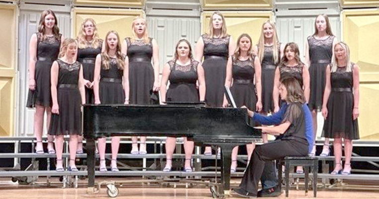 RECEIVING A I RATING AT REGIONALS for their performance of “Shenandoah,” were the SHS girls ensemble. Pictured are (from the left, front row): Katy Post, Cheyenne Hoeting, Addie Struckhoff, Missy Ard, Taigen Kerr, Delanee Bedore; (second row) Aubrey Kesler, Brin Muir, Paytyn McNulty, Tierra Yohon, Ava Dix, and Cappi Hoeting, accompanied by music teacher Megan Riener. The group will represent Stockton at the State Music Contest in Hesston on Saturday, April 29th.