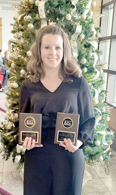 STOCKTON MUSIC TEACHER, MEGAN RIENER, accepts her awards at the KMEA High School and Elementary Honor Band and Choir Concert held at the Beach Schmidt Performing Arts Center on the Fort Hays State University campus on Saturday, December 3rd.
