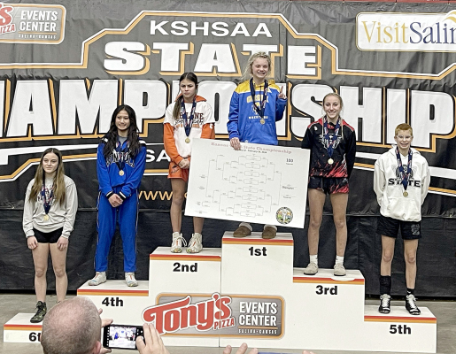 Sporting her 5th-place medal, Carolina Northup stands on the podium at State