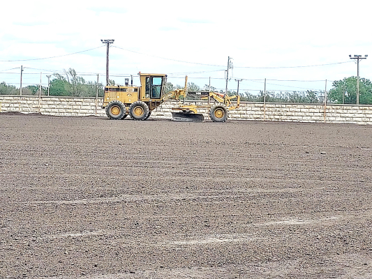 THE ROOKS COUNTY ROAD AND BRIDGE DEPARTMENT employees recently smoothed out the millings laid down at the Fairgrounds in anticipation of the Pride of Texas Shows Carnival coming to Stockton this August for the Rooks County Free Fair!