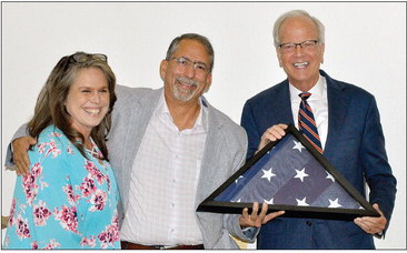 SENATOR JERRY MORAN presented Dr. Dan Sanchez with a flag which was flown over the United States Capitol at the request of Moran, in honor of Sanchez. The presentation was made last Sunday at the open house held for Dr. Sanchez, celebrating 30 years of practicing at RCH.