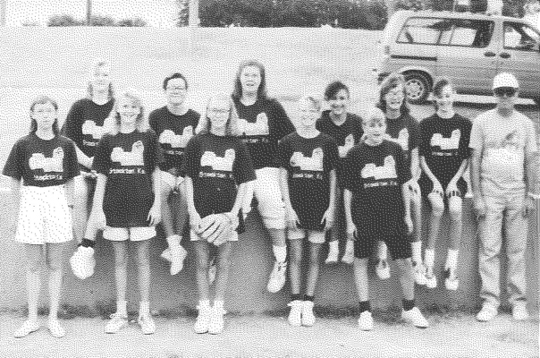 THE 14-AND-UNDER GIRLS FASTPITCH TEAM completed their summer season at the end of July 1991. Members of the group were (front row from left to right): Monica Lowry, Jana Weidenhaft, Hester Wood, Hannah Wood, Whitney Moore; (back row) Jessica Pulec, Deirdra Saunders, Marissa Haines, Valorie Hahn, Melissa Hollern, Ginger Nichols, and coach Jimmy Jackson. Not pictured: Amy Lowry, Amy Kriley, Tara Hahn, and Casey Maddy.