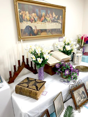 MANY RELIGIOUS ARTIFACTS around Rooks County are at the Rooks County Historical Museum. The altar, Bibles, and pictures commemorate the Easter season. They are now on display at the facility.