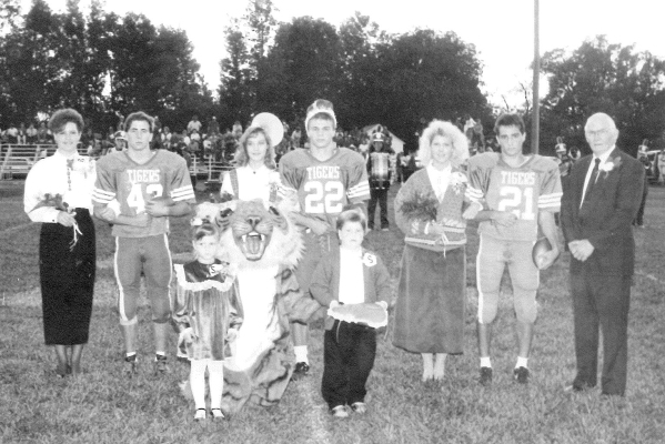 THE 1990 STOCKTON HIGH SCHOOL HOMECOMING QUEEN AND KING were Julie Kriley and Jeremy Krob. Pictured are (from left): Janel Strutt, Duane Smith, Queen Julie Kriley, King Jeremy Krob, Angie Johnston, Jason Miller and principal Earl Richter. Crownbearers were Danielle Berland and Tyler Muir.