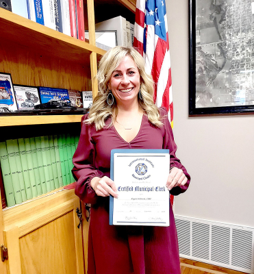 AT THE RECENT Stockton City Commission meeting on Tuesday, October 16th, assistant city clerk Kayla Hilbrink was presented with a Certified Municipal Clerk title certificate for completing the requirements prescribed by the International Institute of Municipal Clerks.