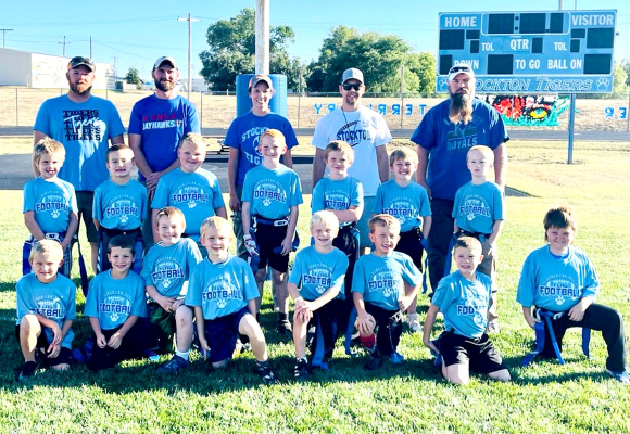 MAKING UP the first and second-grade Stockton Recreation Flag Football team were (front row, from left) Kasyn Lowry, Rhett Riffel, Waylon Baker, Carson Riener, Jevin Rush, Rekker States, Grandon Mongeau, Ryker Whitney; (middle row) Brodie Kreutzer, Hudson Horn, Trent Look, Waylon Ghumm, Grayson Brown, Ryder Swaney, Kirk Brassfield; (back row) and coaches David Ghumm, Zach Horn, Ginger Riffel, Jeff Reiner, and Jez Rush. (Not pictured are Malea Jones and JoyAnna Dixon.)