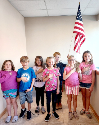 STARTING OFF the Stockton USD 271 Board of Education regular meeting on by reciting the Pledge of Allegiance on Monday, October 10th were the second grade students of Mrs. Jen Kesler: Pictured are (left to right): Kaisyn Muir, Cohen Muir, Sophia Hansen, Norah Muir, Ira Beall, Emery Peterson, and Cambry Glendening.