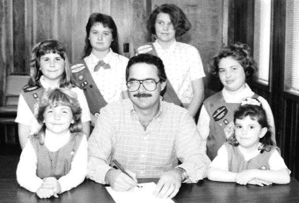 STOCKTON MAYOR KEITH SCHLAEGEL signed the 1991 Girl Scout Week proclamation. Pictured are (front row, from left): Angela Horn Mayor Schlaegel, Heather Lowe, (back row) Hannah Casad, Annie Yakish, Dawnite Walker, and Jesica Miller.