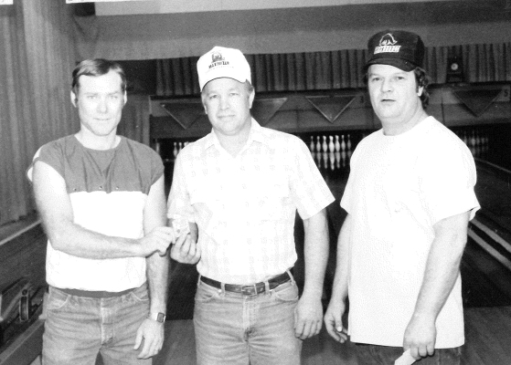 DURING LEAGUE BOWLING at 183 Lanes in April 1991, John Gager picked up a 7-10 split. He is pictured with league president David Peterson, John, and 183 Lanes owner Jerry Sterling.