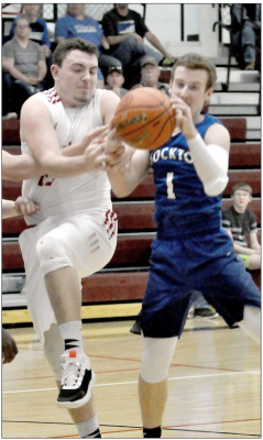 TREVOR MILLER, right, goes after a loose ball during action in Stockton’s win over Logan in the Regional finals last Saturday.