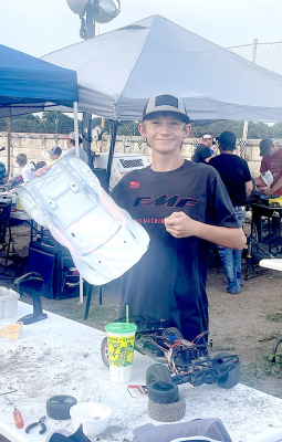 HADEN HAHN had to make some repairs to his remotecontrolled car before hitting the track again during the Purple Ribbon RC Racing held on Tuesday evening of the Rooks County Free Fair.