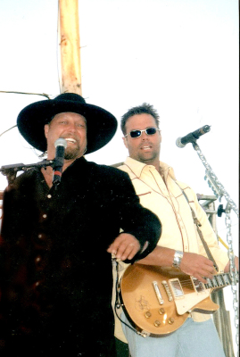 MONTGOMERY GENTRY rocked out on the grandstand stage at the Rooks County Free Fair in 2012. Their high-energy performance left the crowd wanting more, and they delivered!