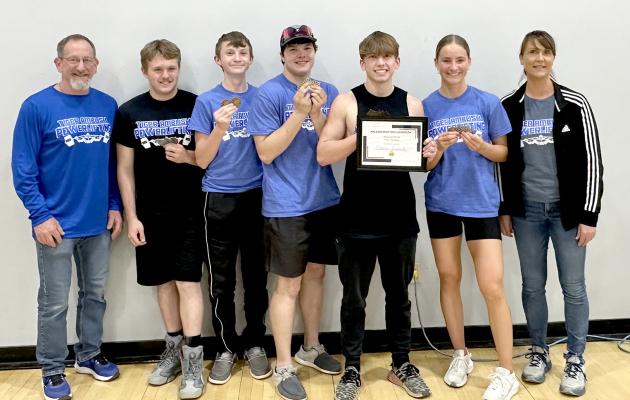 THE TIGER AMBUSH POWERLIFTERS brought home several medals, and set some new records and PRs at the NPL Powerlifting Meet held in Lincoln on March 21. From left are: Coach Justin Basart, Deacon Creighton, Haden Hahn, Zach Young, Cason Iwanski, Ava Dix, and Coach Janet Kuhlmann.