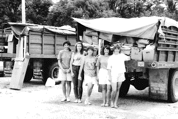 SHOWN ARE some of the FST (Friends, Sisters Together) who manned the trucks in June of 1991 to collect some of the paper saved for the paper drive. From left: Ruthie Muir, Jenny Riffel, Gina Muir, Ginger Kollman, and Pam Hageman.