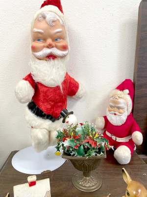THESE JOLLY SANTAS are just some of the Christmas “kitch” at the Rooks County Historical Museum on display during the month of December.